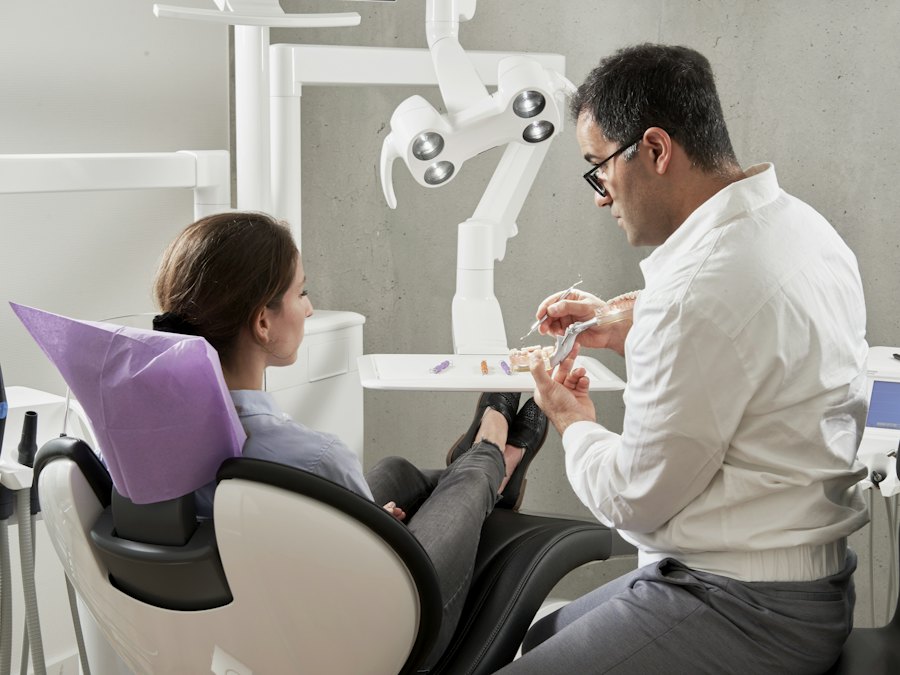 Dentist explaining root canal treatment to a patient